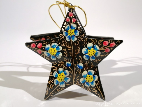 Black floral star decoration product photo